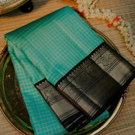 Turquoise Blue Saree with Black and Gold Border