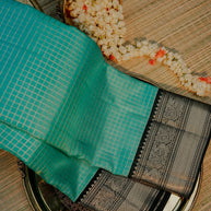 Turquoise Blue Saree with Black and Gold Border