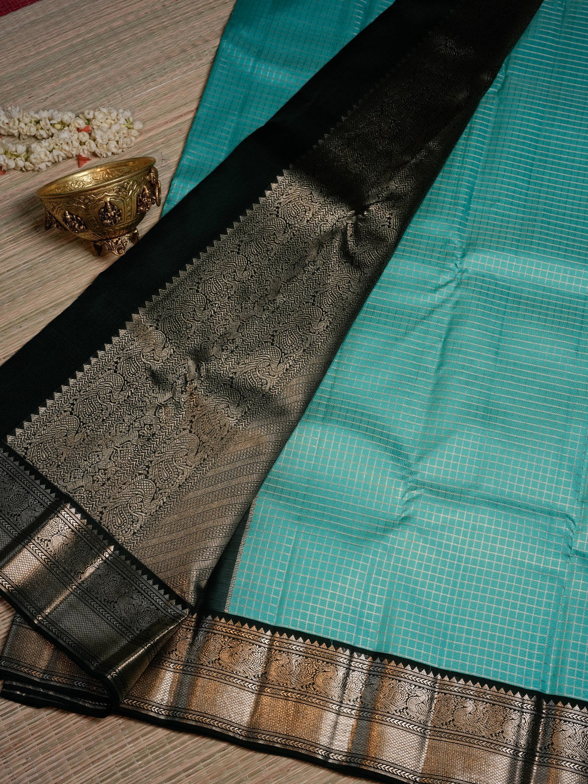 Turquoise Blue Saree with Black and Gold Border